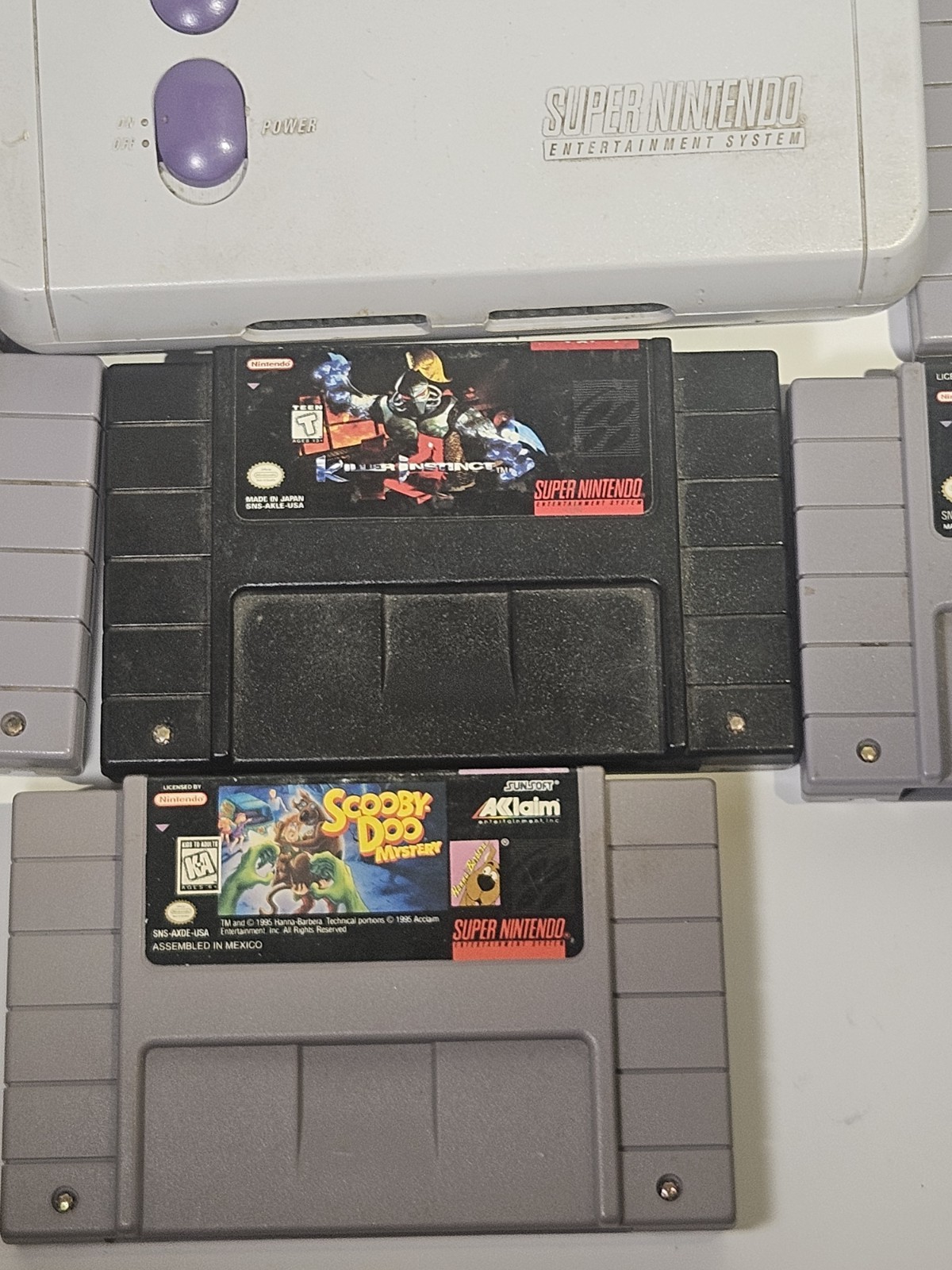Super Nintendo SNES JR Console with 8 games, cords, and 1 controller