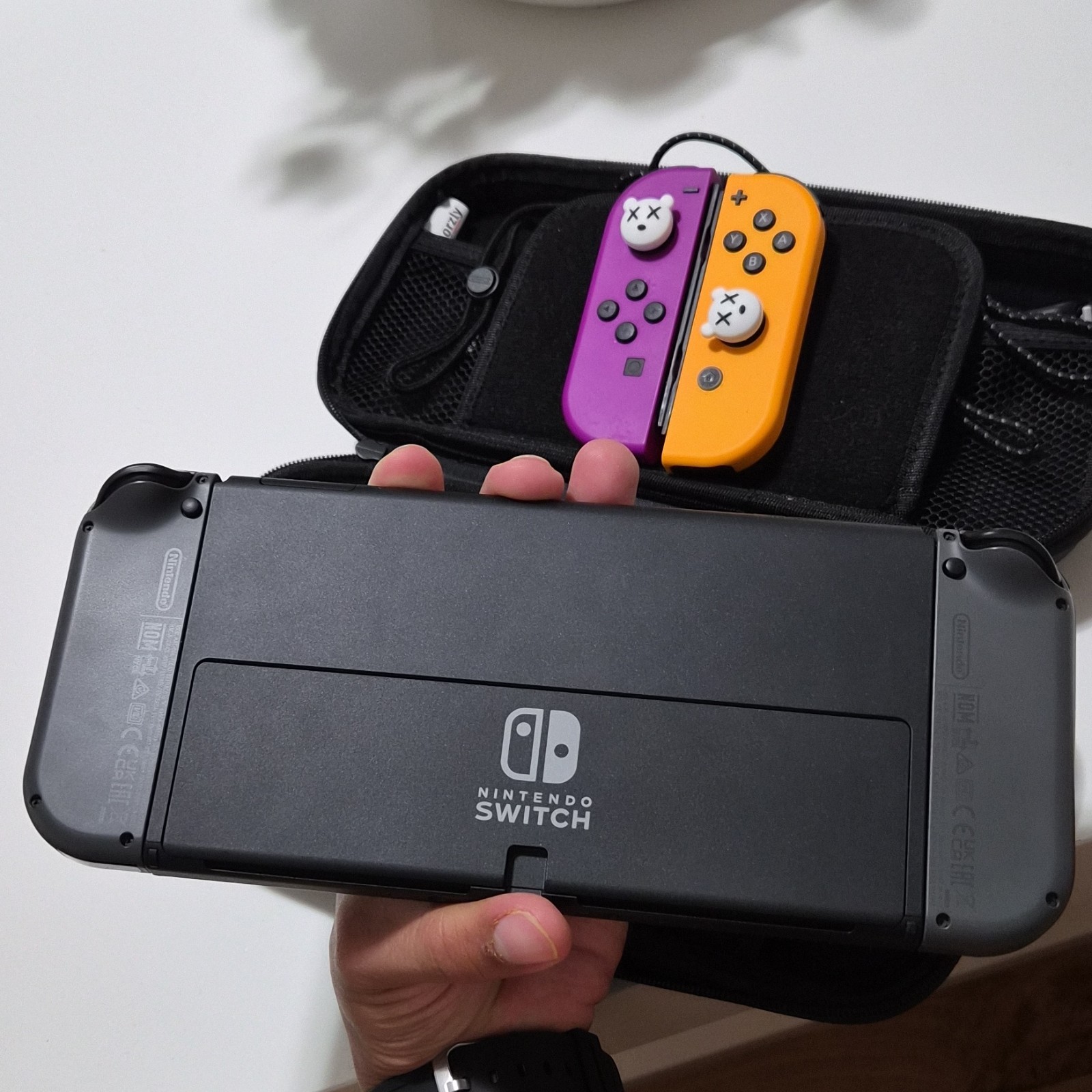 Nintendo Switch Black/Gray Console with Purple and Orange Joy-Con Controllers