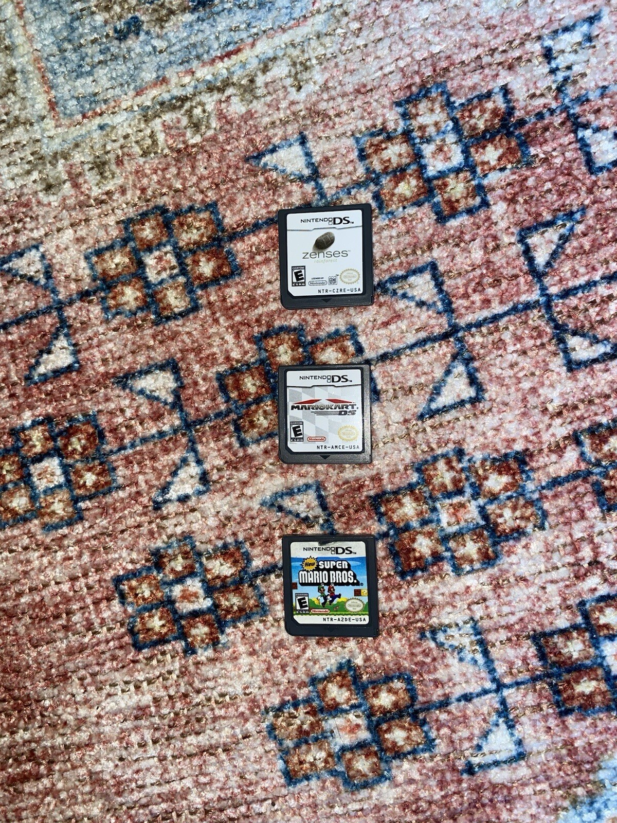 Red Nintendo 3DS XL with 3 games, charger not included