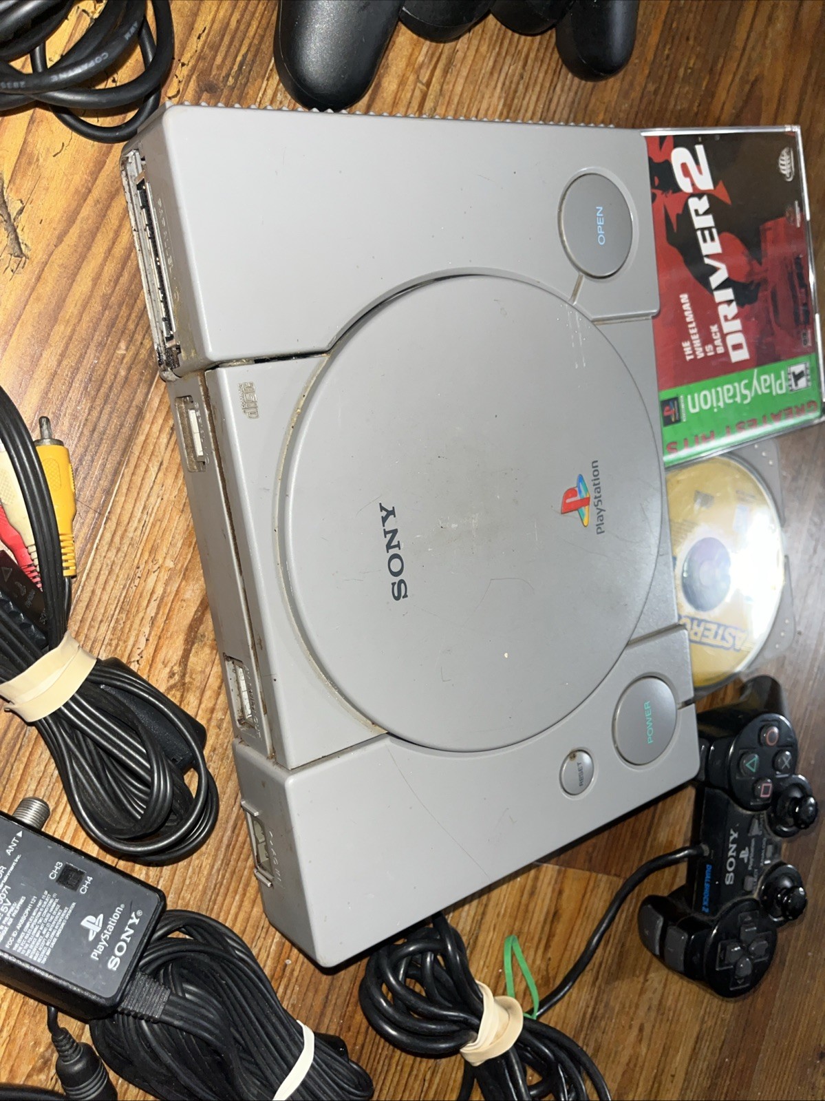 Sony Playstation 1 Gray Console With Games Controllers, A/V Cable, and Power