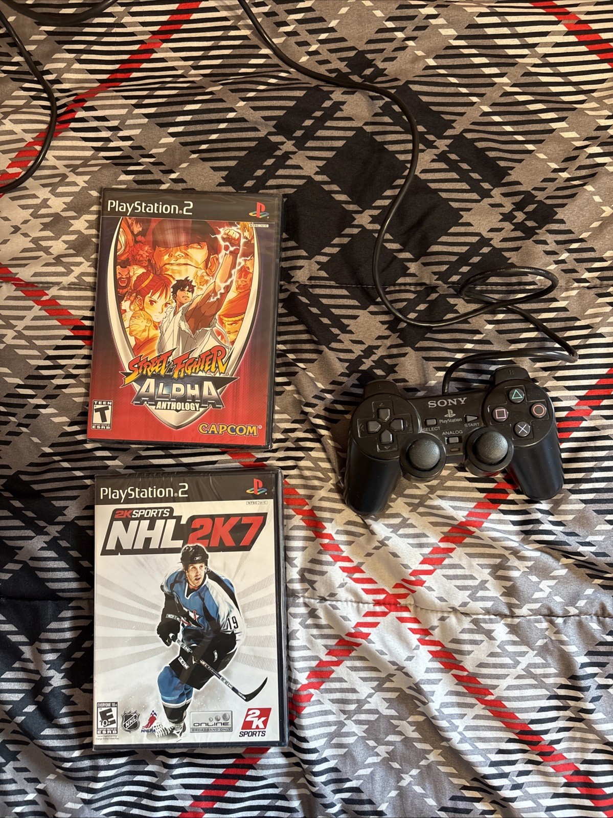Sony PS2 Console, Controller, 4 Player Adaptor, Wires, 8mb Memory Card,& 7 Games