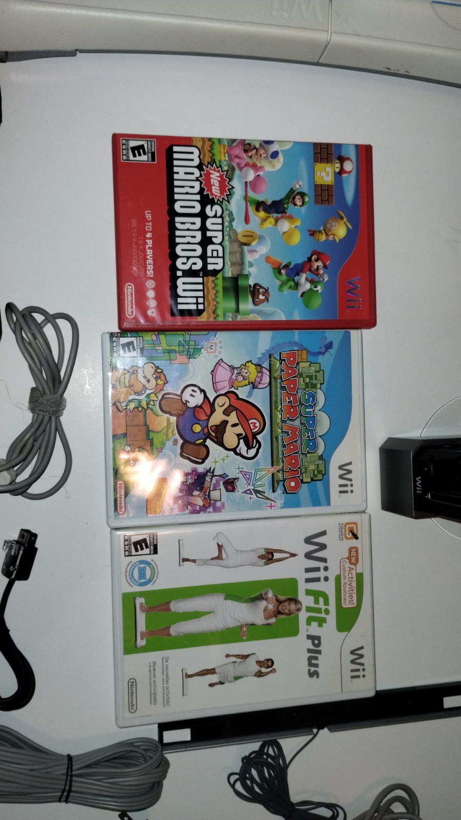 Nintendo Wii Console Bundle with Two Remotes & 3 Games And Wii Fit Board
