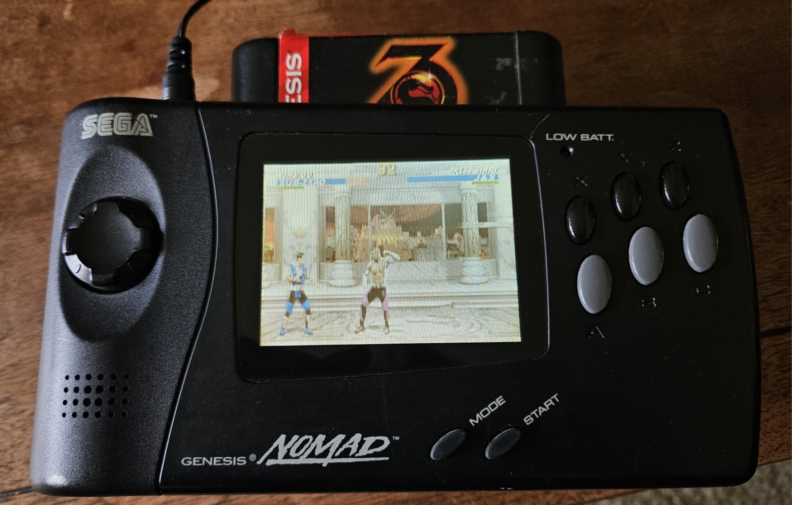 SEGA Genesis Nomad Handheld Console Black with AC Adapter & Battery Pack + Game