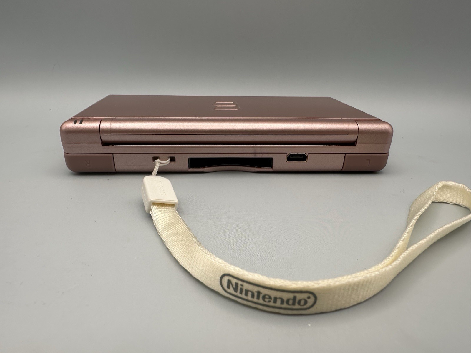 Nintendo DS Lite USG-001 Metallic Rose – original slot cover, stylus, wriststrap