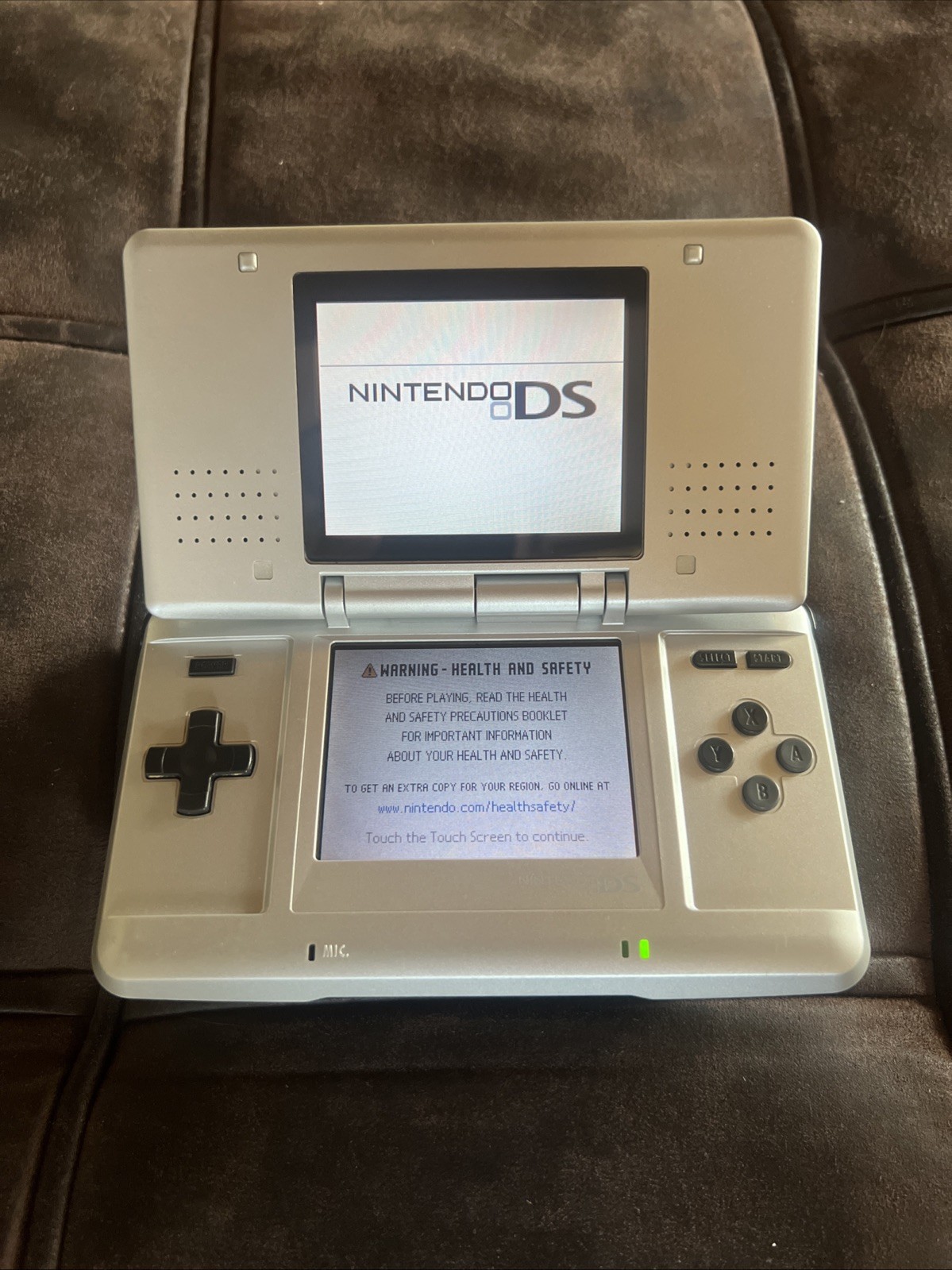 Titanium silver Original Nintendo DS with charger and stylus