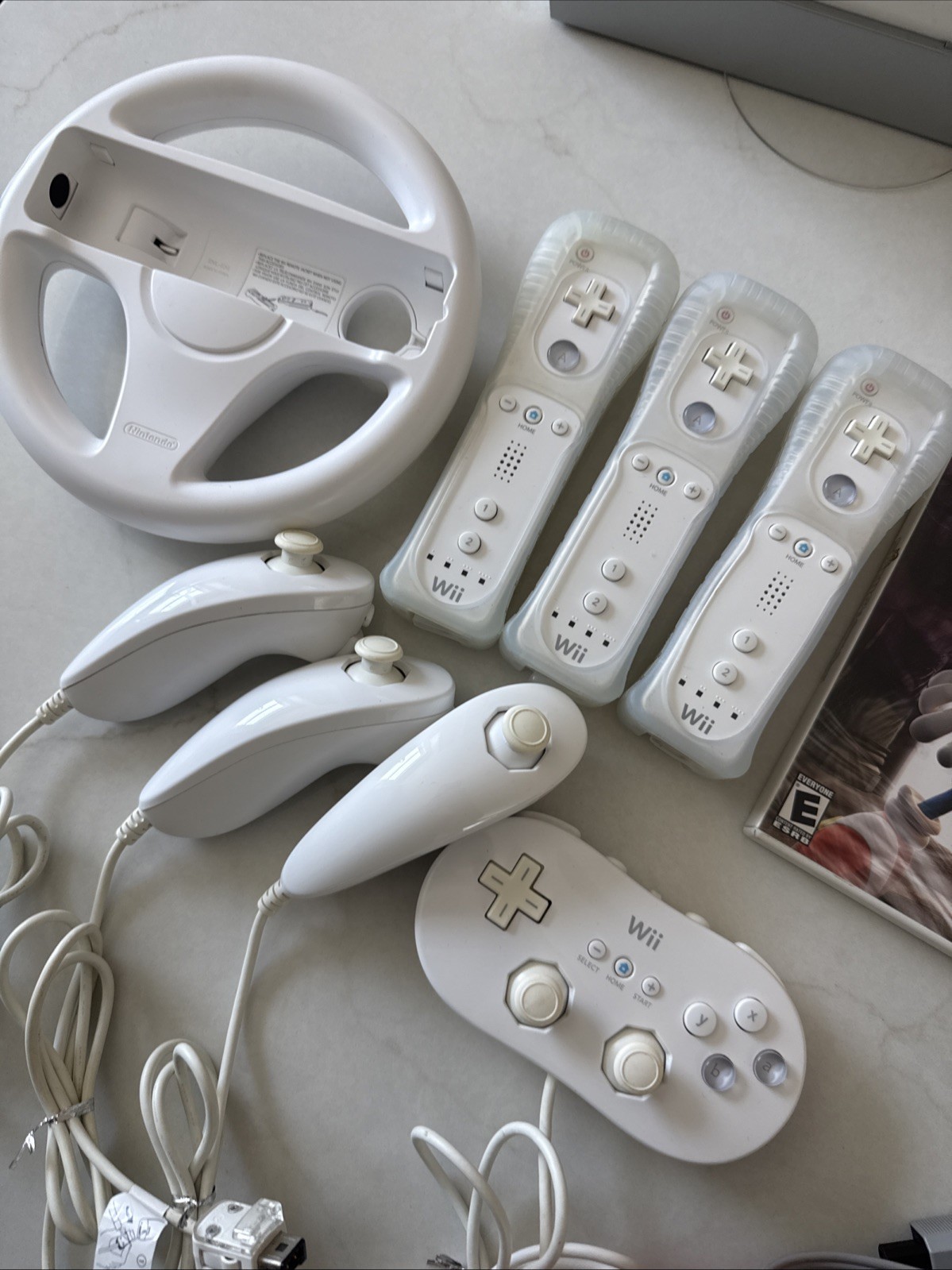 Nintendo Wii Bundle 7 Games, 3 Controllers, Nunchucks, Classic Controller Wheel