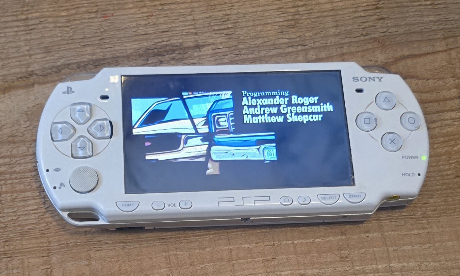 White Psp 2000 With Charger. The System Has Been Tested And Works Great.