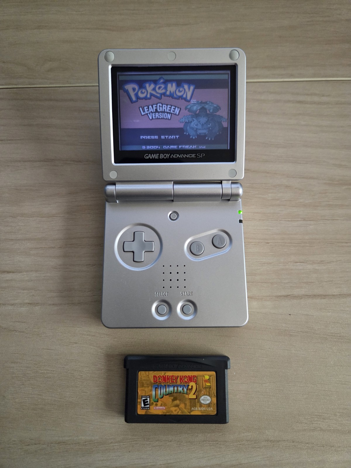 Platinum Nintendo Game Boy Advance SP (AGS-001) CIB with Pokémon Leaf Green