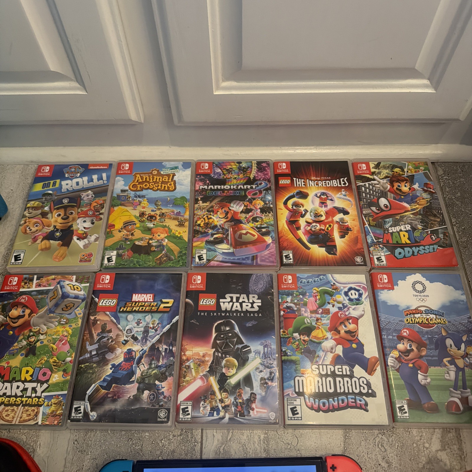 Nintendo Switch OLED BUNDLE 64GB 10 games w 5 Mario games & Comes w/ attachments