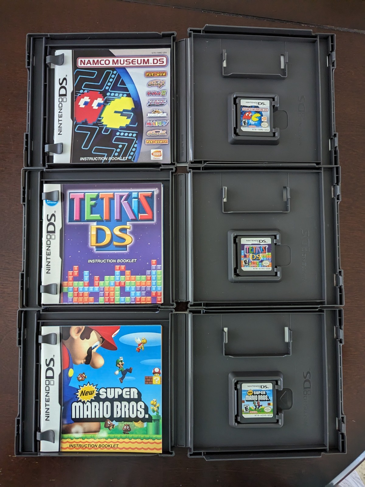 Nintendo DS Lite with Charger, Hard Case, soft case, 15 games in cases.