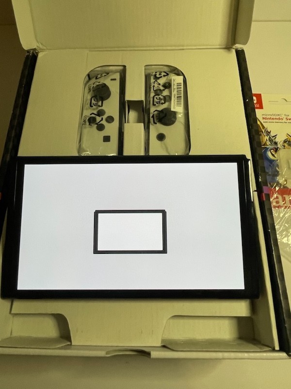 Nintendo Switch OLED – White Joycon With 64gb SD card (no game included)