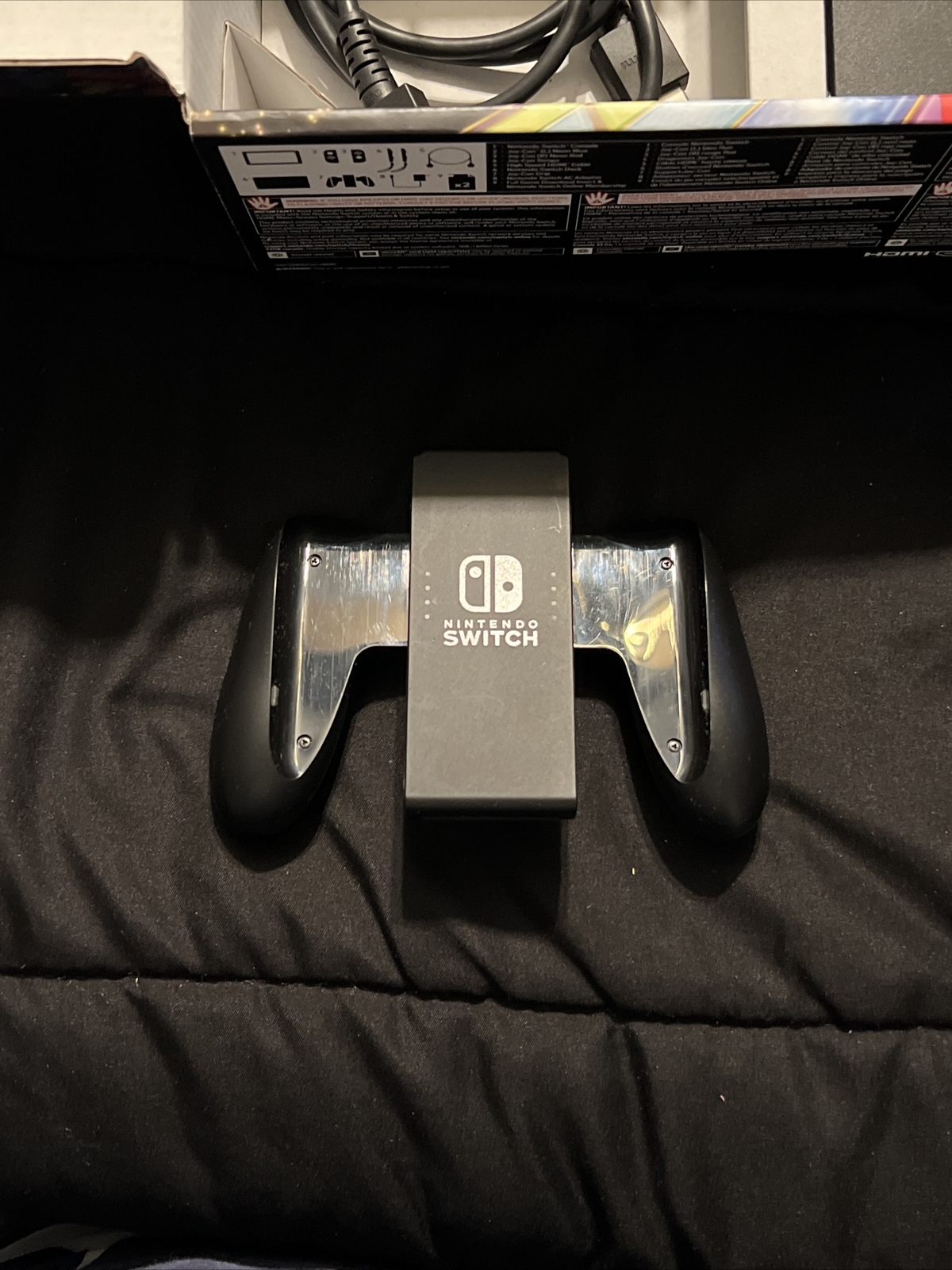 Nintendo Switch Blue and Red Joy-Con Controllers and Mario Kart 8