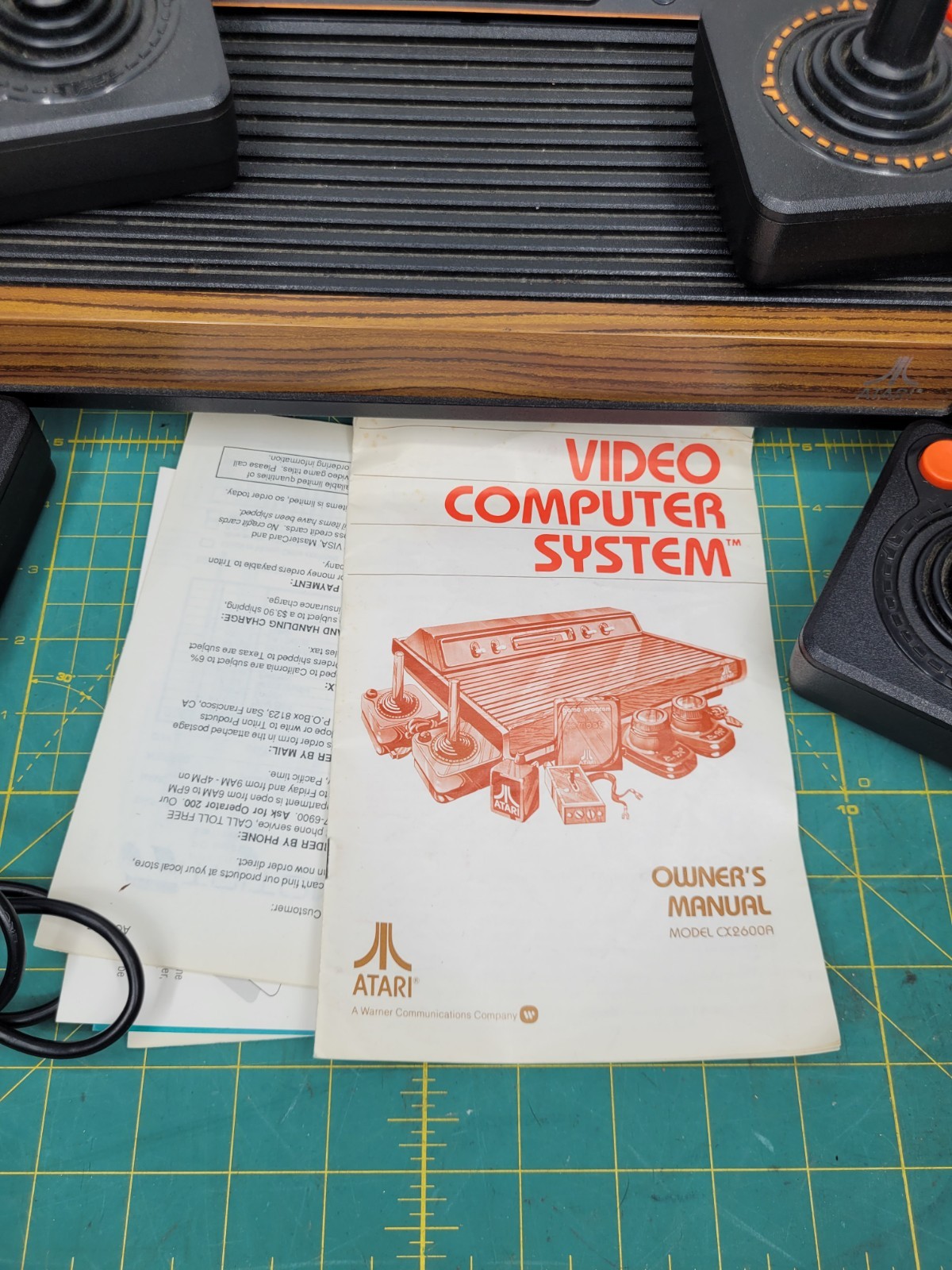 Atari 2600 console With Cords And 4 Joystick Controllers Powers On Needs Work