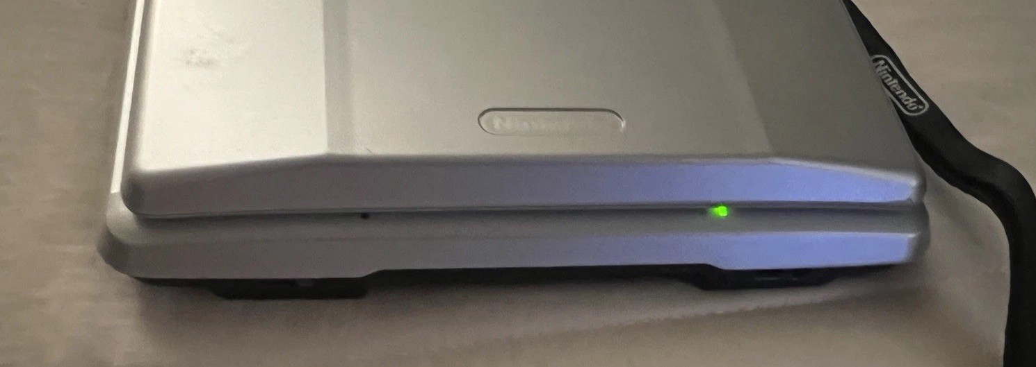 Nintendo DS System Silver NTR-001 WORKS GREAT W/CHARGER, CASE & 2 GAMES EUC