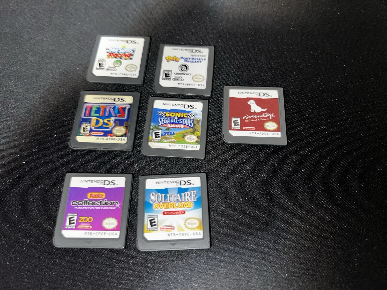 Nintendo DSi XL Handheld System – Midnight Blue w/ 7 games Bundle.