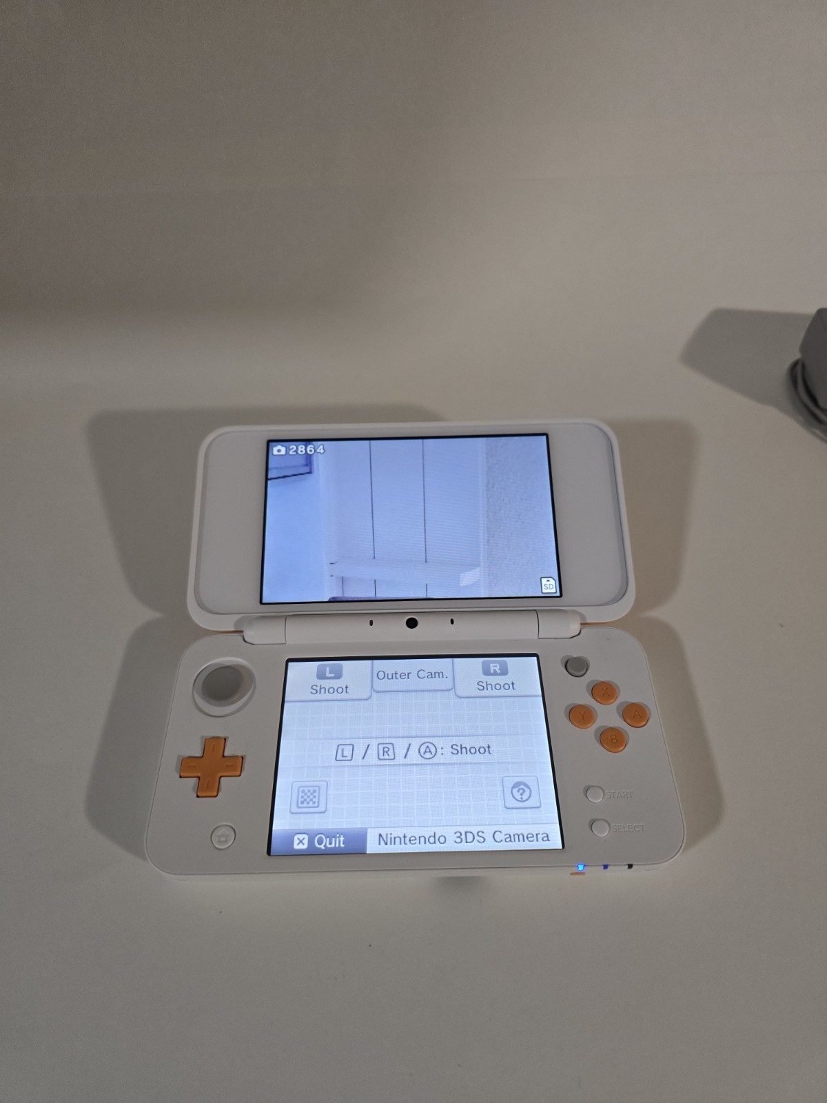 Nintendo 2DS XL Console – White/Orange + Game Cartridge