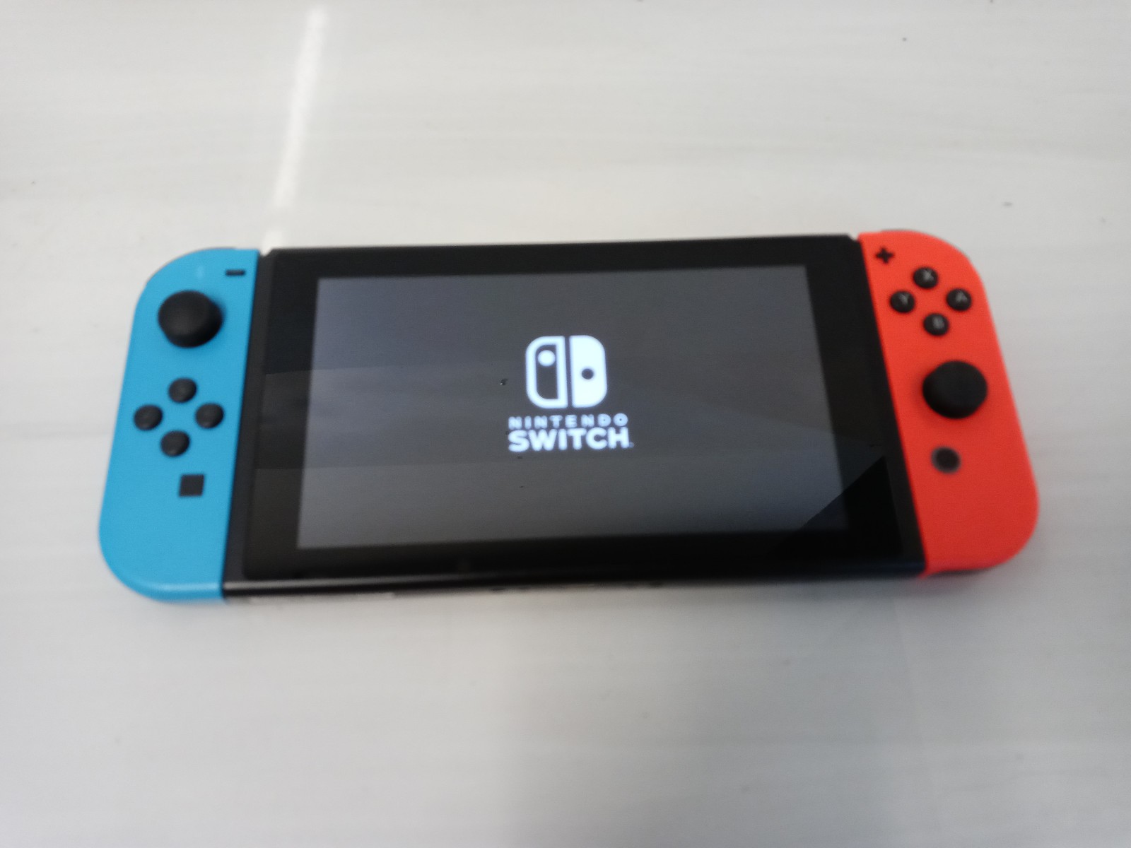 Nintendo Switch 32GB Game Console Only with Neon Blue / Red Joy-Con, (HAC-001)
