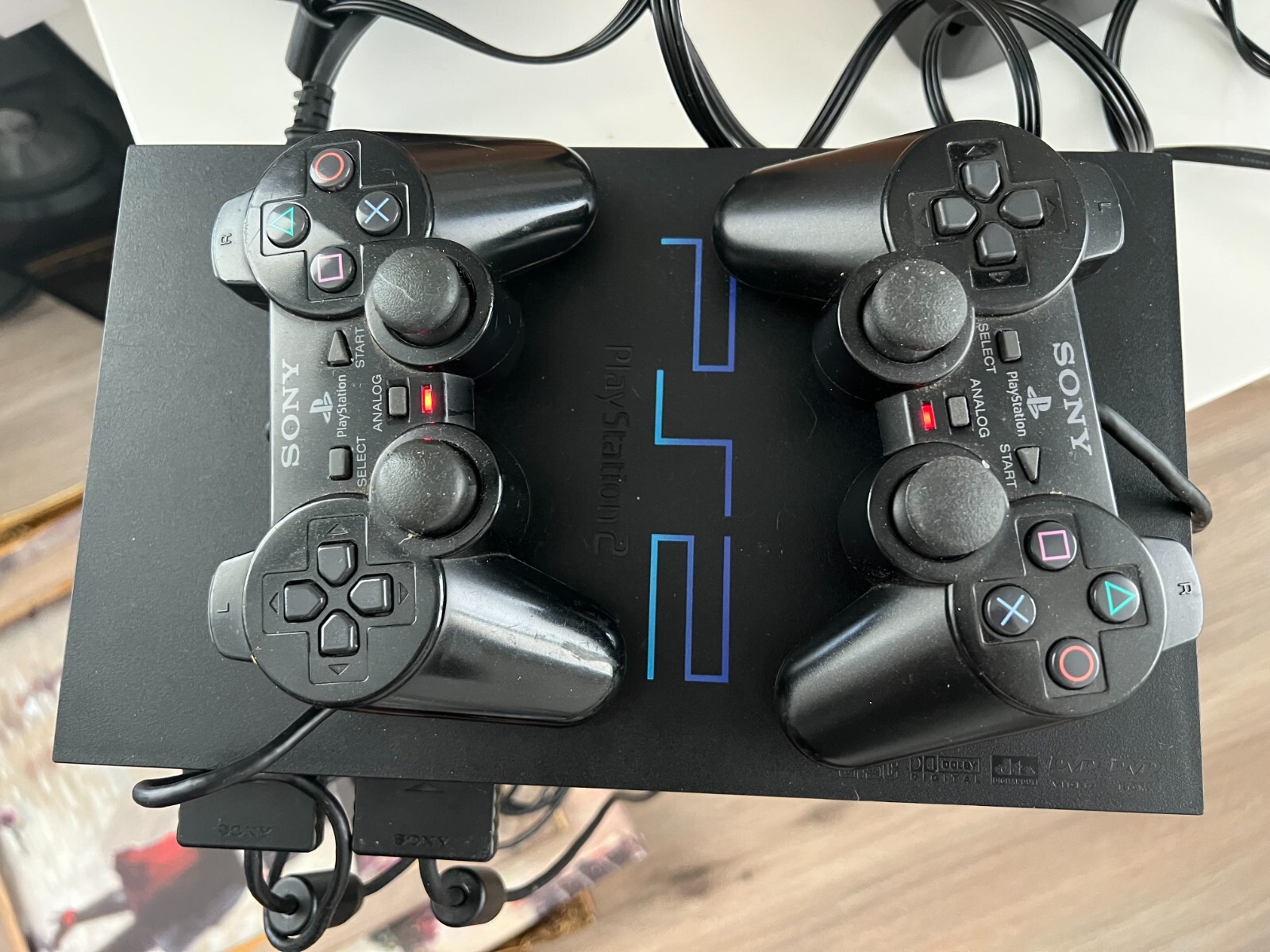 PlayStation 2 console bundle (2 controllers, 2 games, & 3 8mb memory cards)