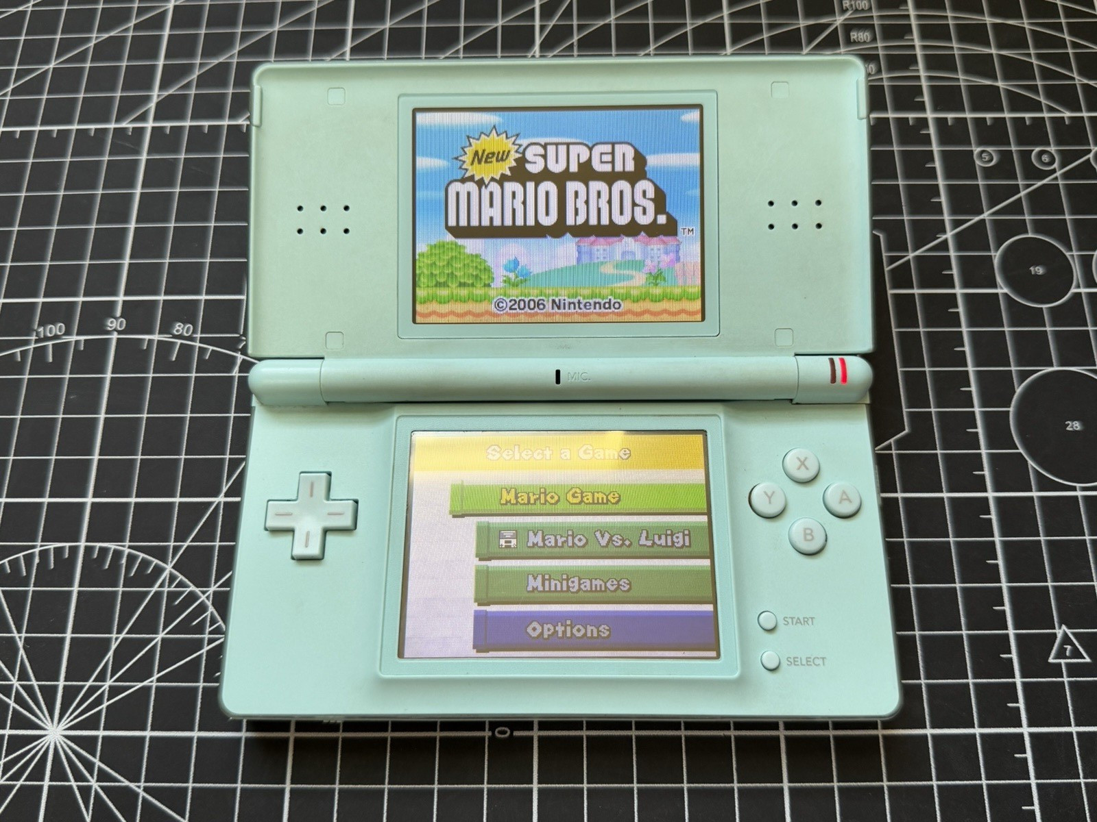 Nintendo DS Lite Used OEM Silver W/ R4 & 2GB SD – 100% Tested Region Free