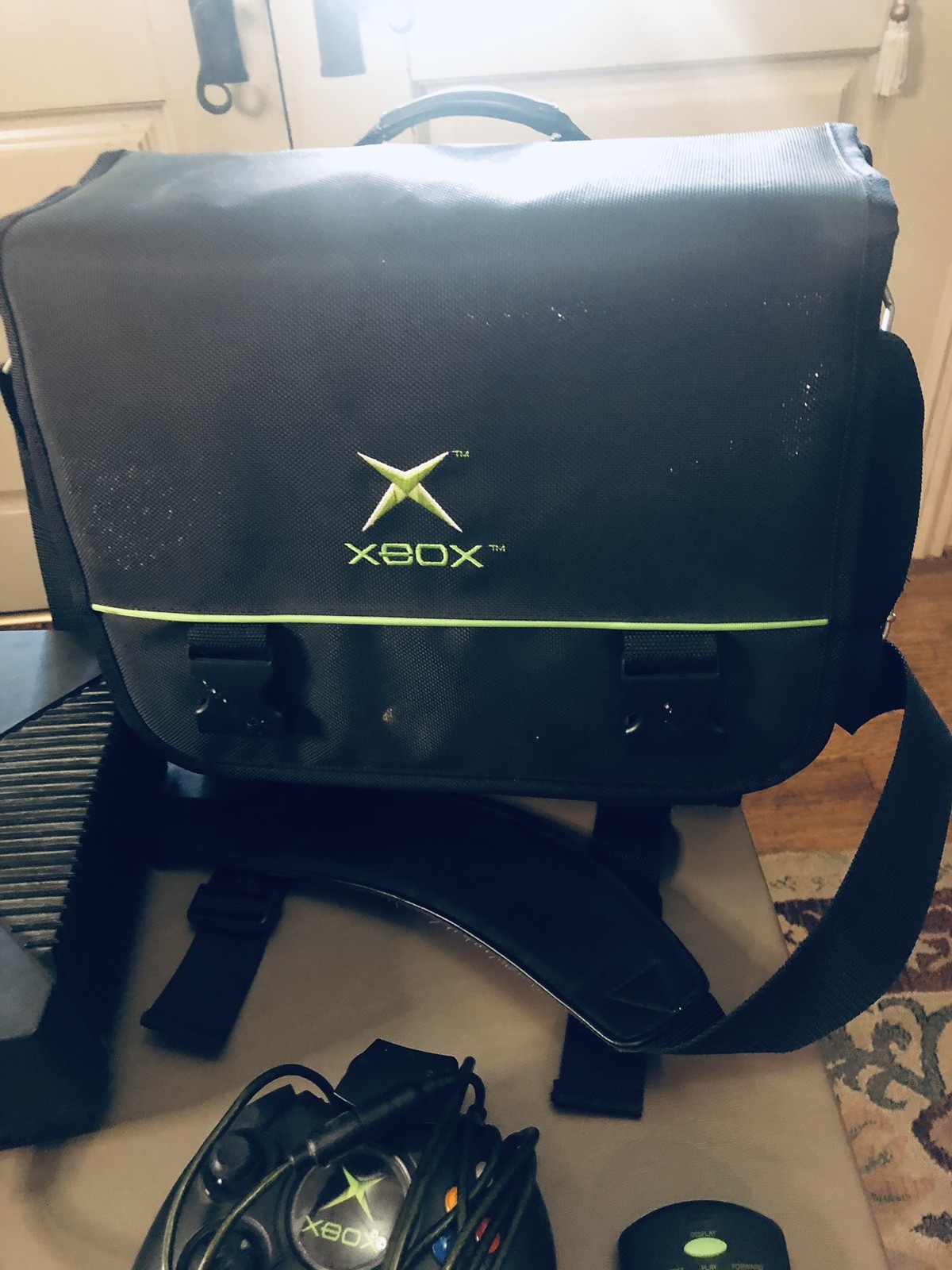 Xbox console, three controllers, carryting case, 2 games, and more