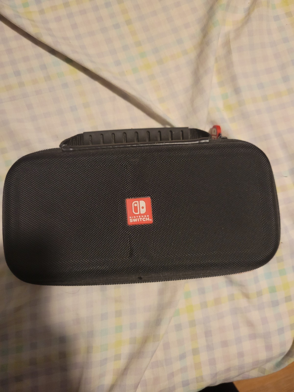 Used Nintendo Handheld Switch Console – Black with Blue and Yellow Joycons