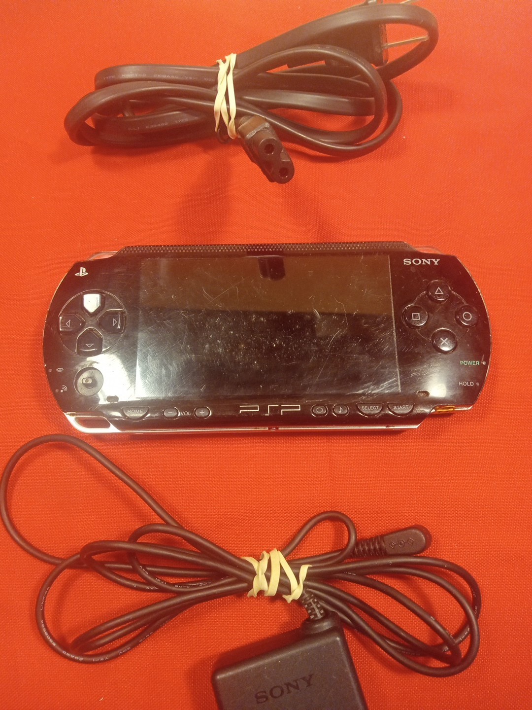 PSP 1001 CONSOLE+AC ADAPTER/NO TOGGLE BUTTON OR BATTERY & COVER/ SEE…