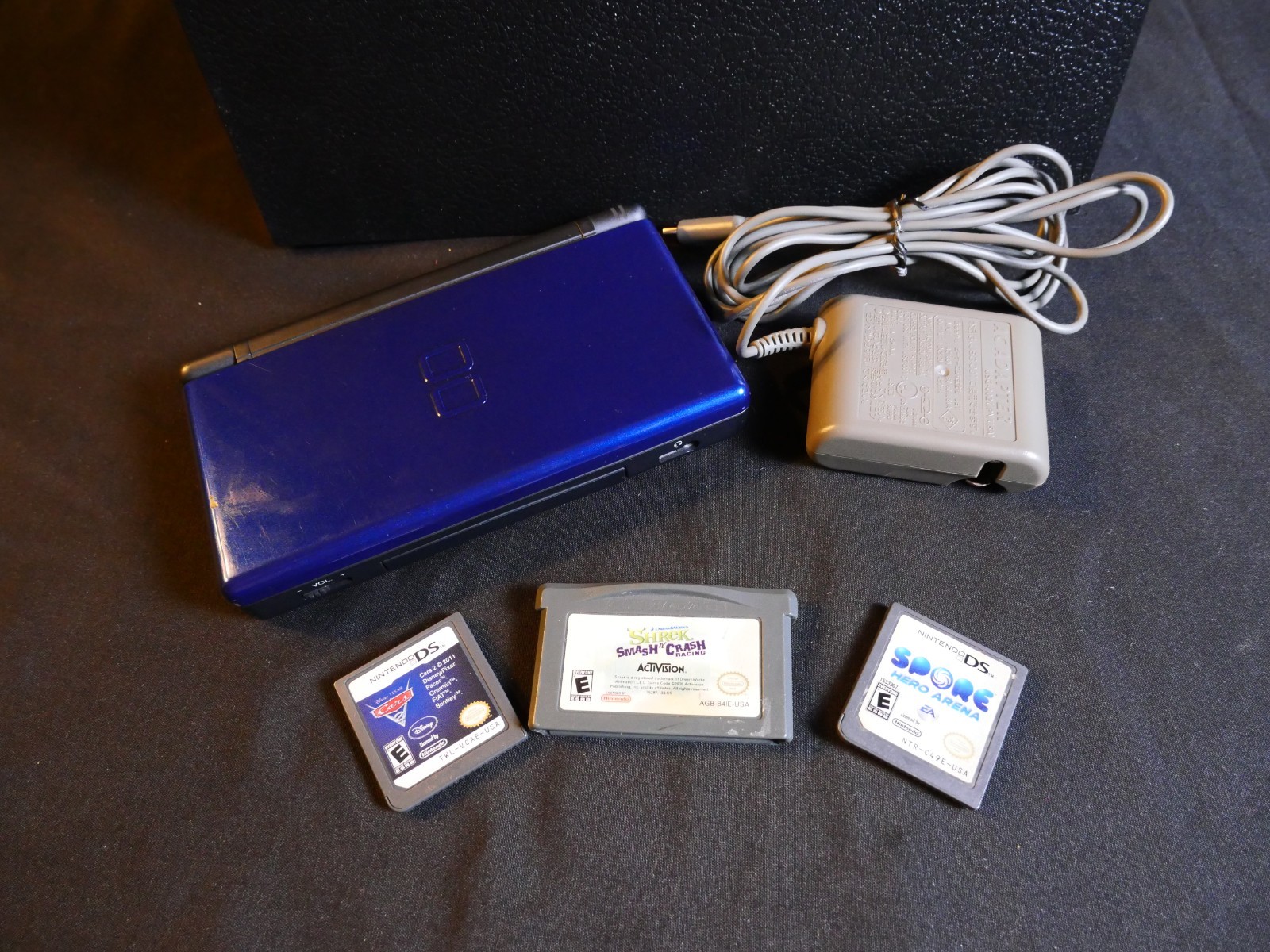 Nintendo DS Lite Blue/Black W/ Charger, Spore, Cars 2, Shrek Smash n’ Crash