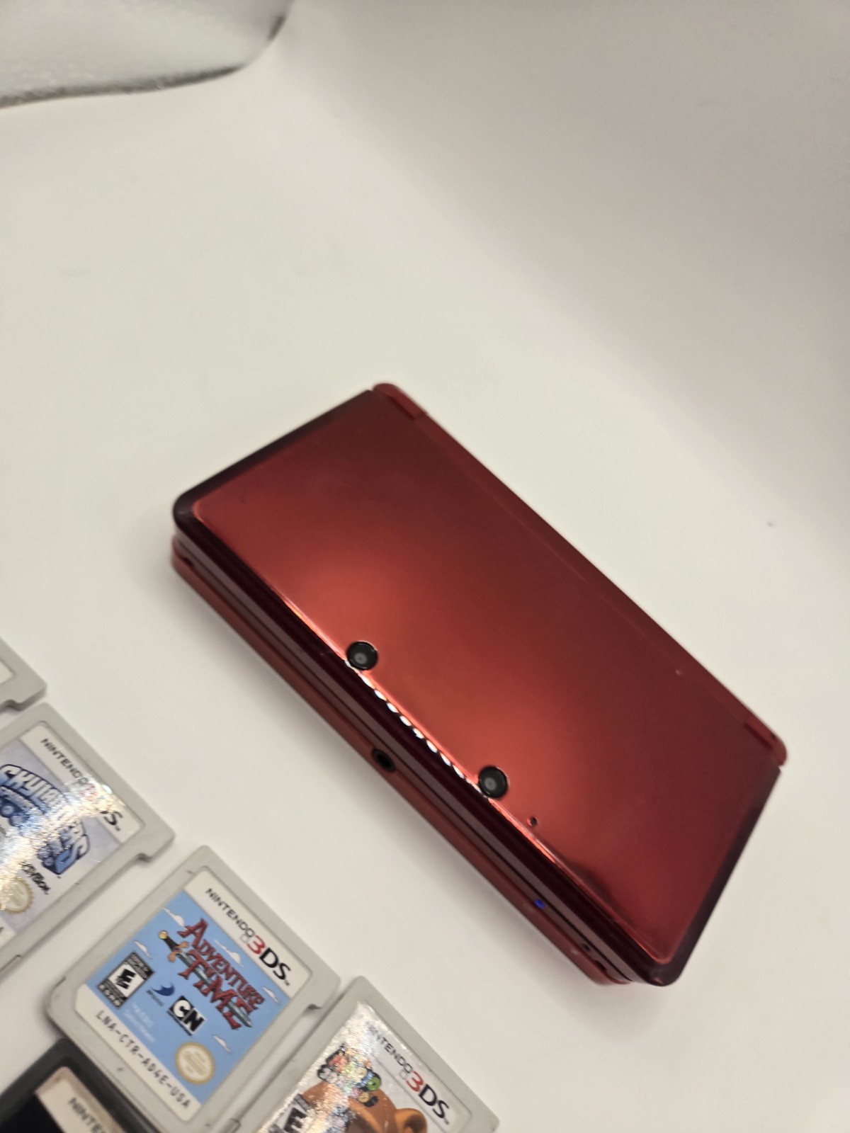 Nintendo 3DS Metallic Red Console System with 7 GamesNo Charger No Stylus