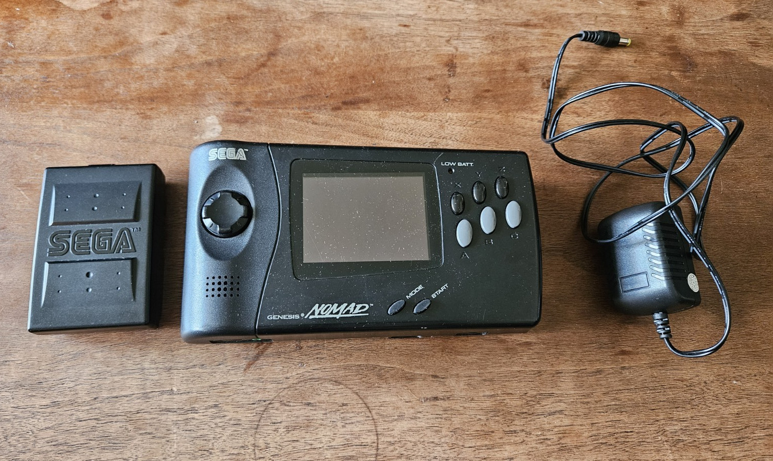 SEGA Genesis Nomad Handheld Console Black with AC Adapter & Battery Pack + Game