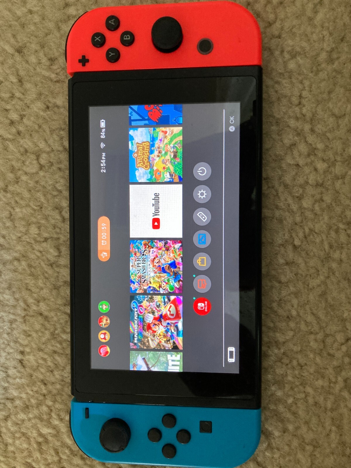 Nintendo switch – Red/Blue Controller. Includes 128GB MicroSD and 3 Games