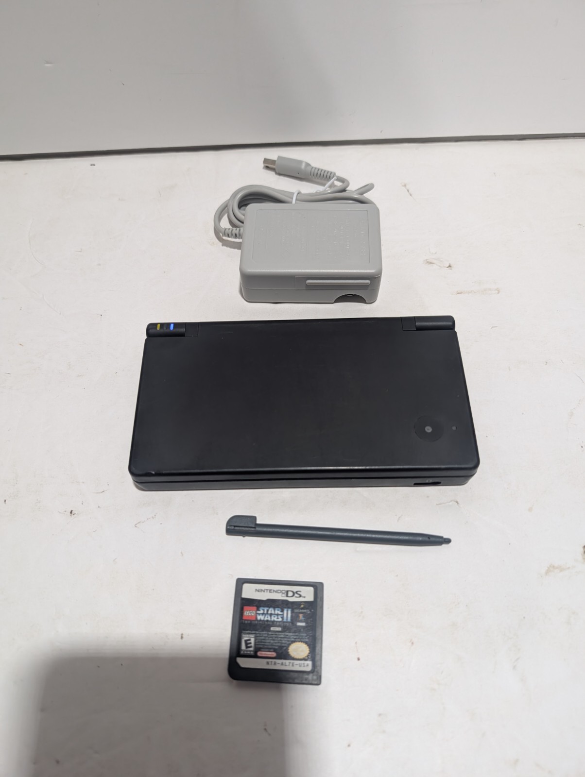 Nintendo DSi Black Console + Charger + Stylus + LEGO Star Wars II–Tested Working
