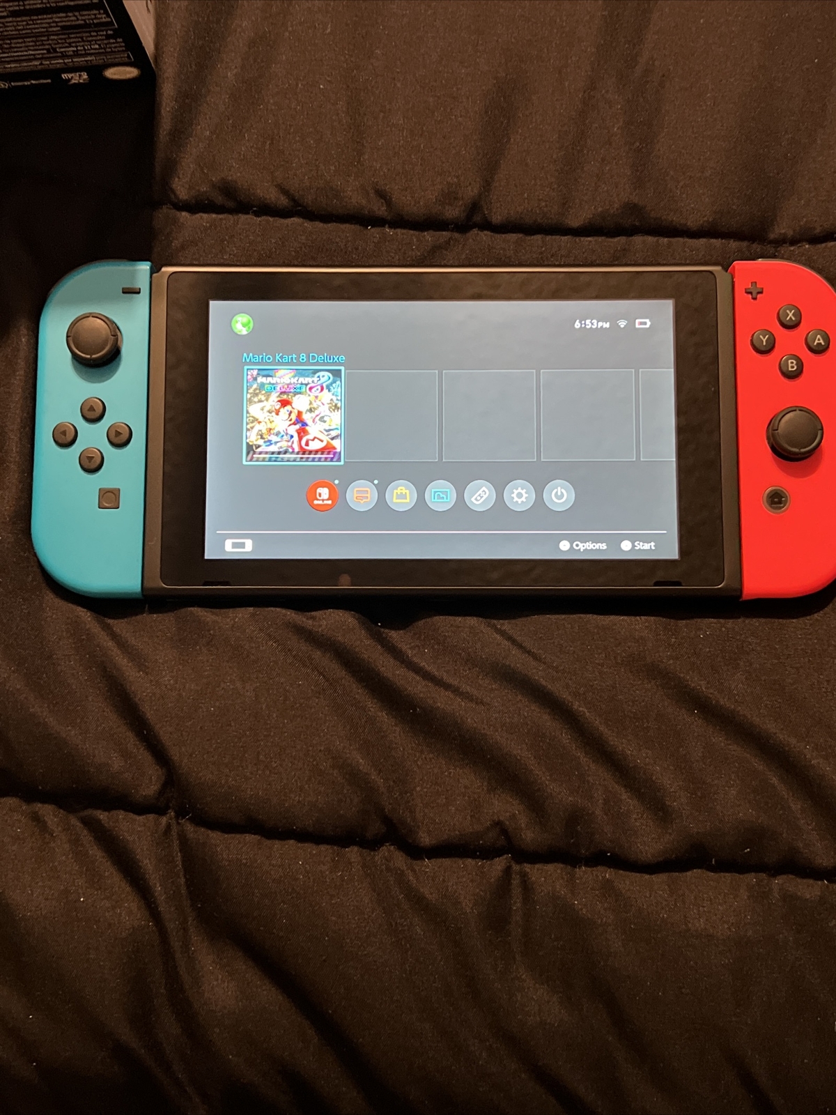 Nintendo Switch Blue and Red Joy-Con Controllers and Mario Kart 8