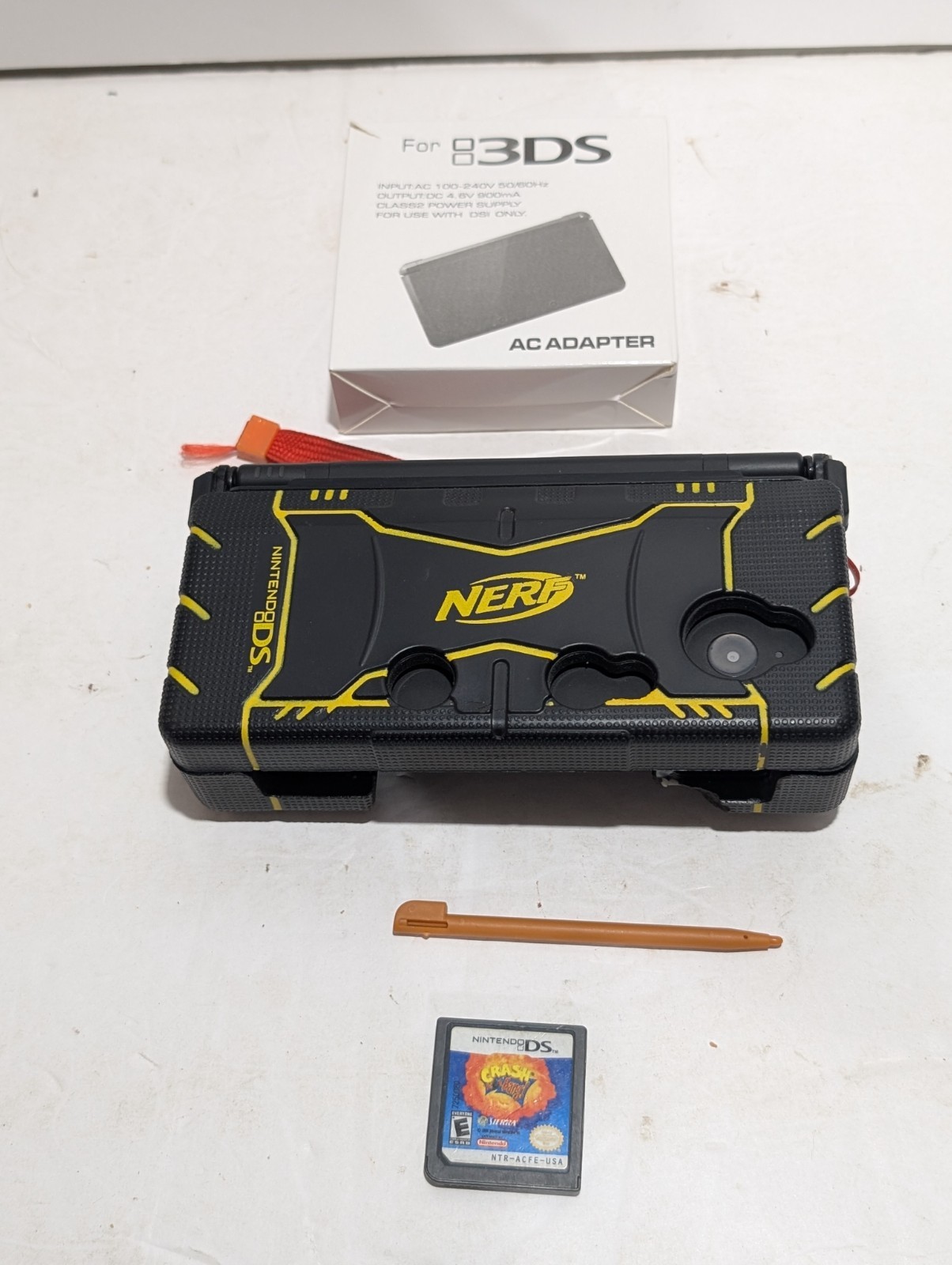 Nintendo DSi Bundle (DSi + NERF Case + Charger + Stylus + Game)