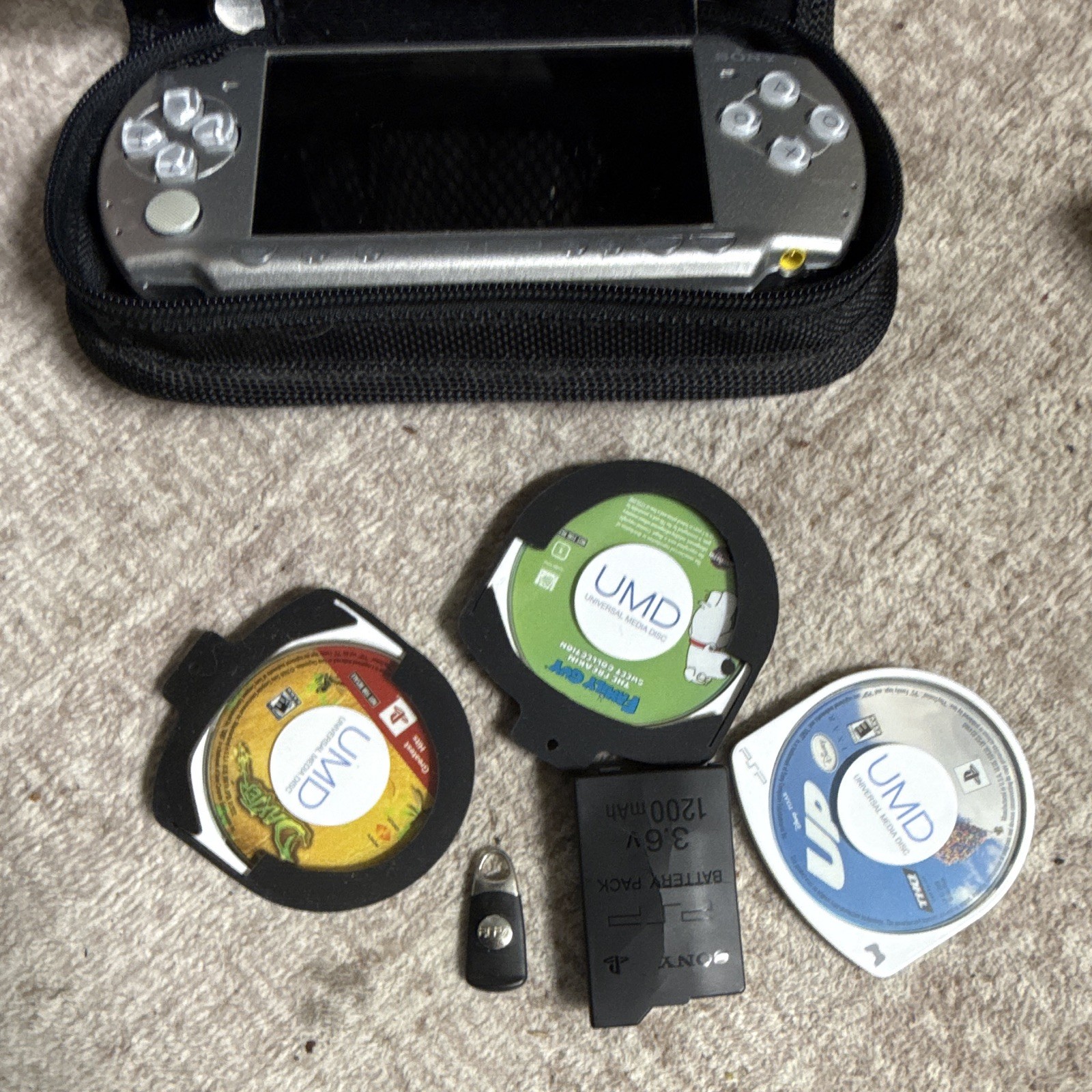 Sony PSP-2001 Silver Handheld System Bundle w/ Case, Battery Pack & UMD Games
