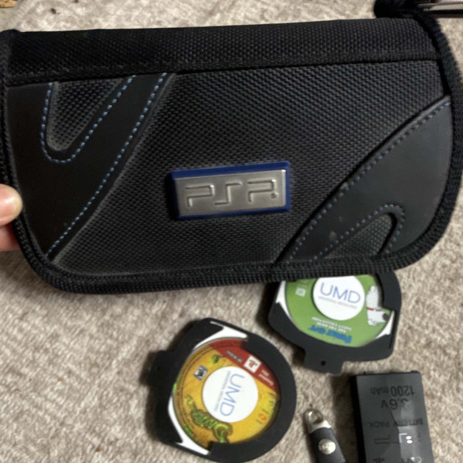Sony PSP-2001 Silver Handheld System Bundle w/ Case, Battery Pack & UMD Games