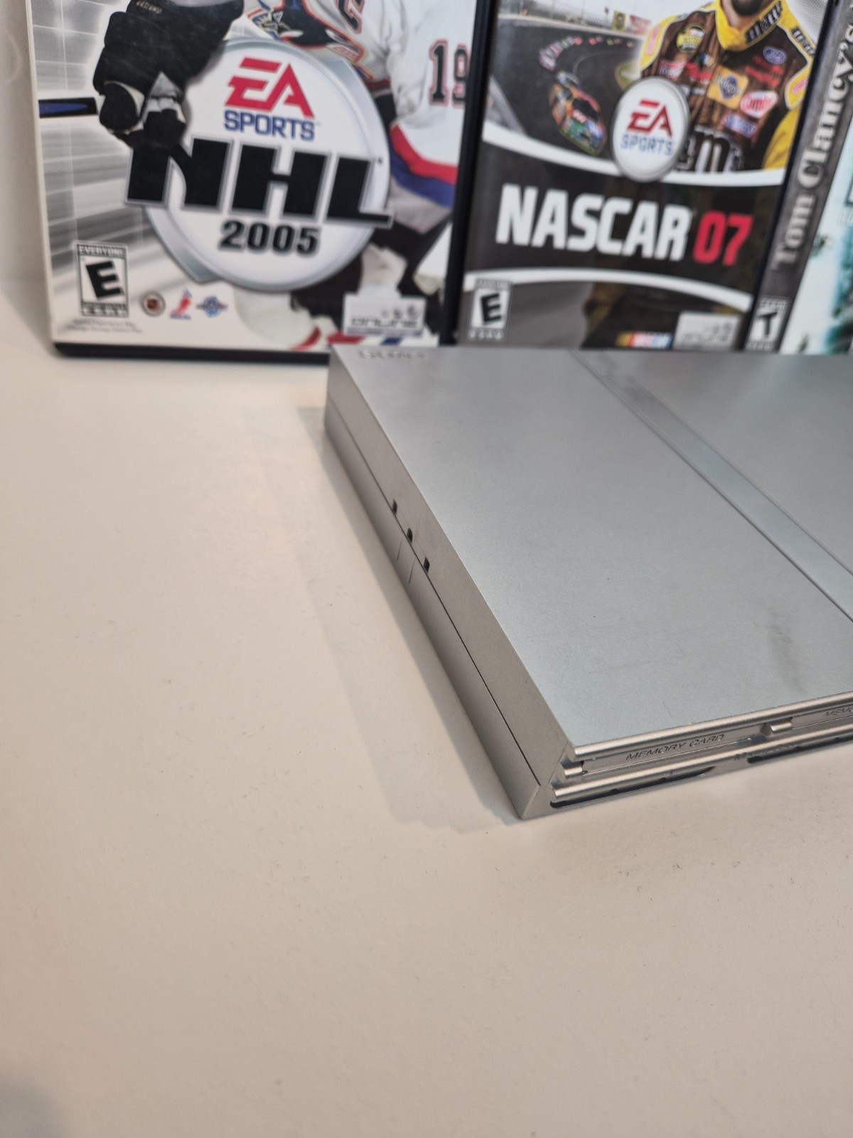 NEW LASER Silver PS2 Slim SCPH-77001 Bundle -NEW BATTERY – Cleaned 4 games Cords