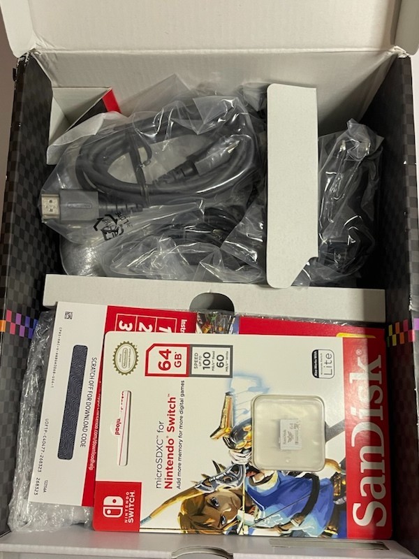 Nintendo Switch OLED – White Joycon With 64gb SD card (no game included)