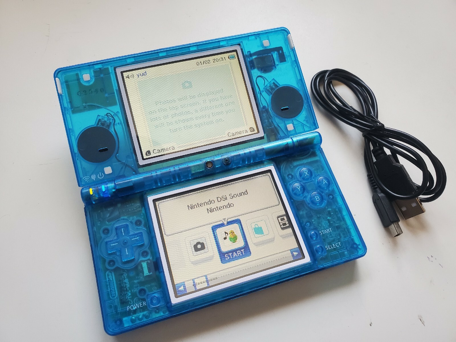Nintendo DSi clear blue Handheld System+ charger