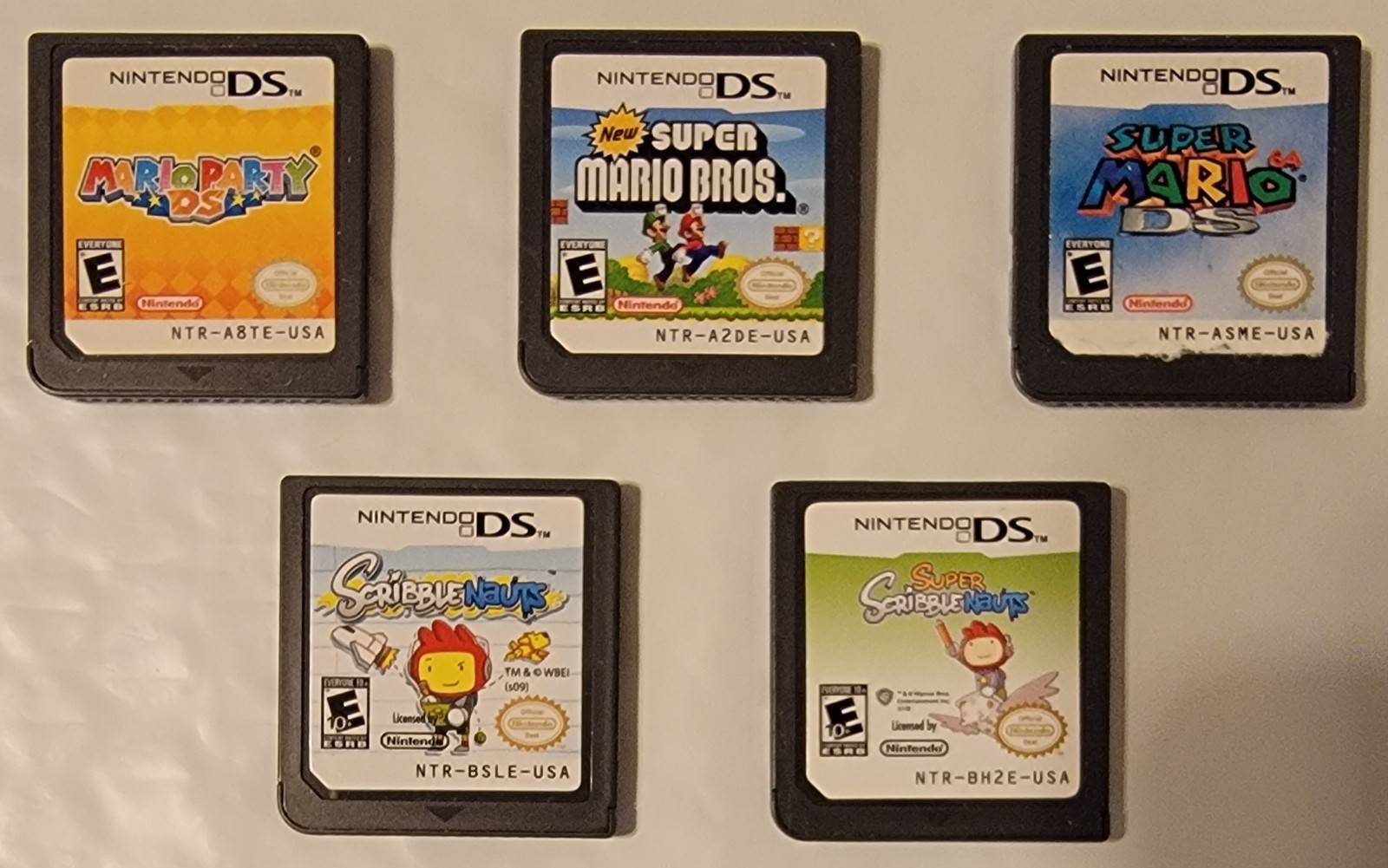 Nintendo DSi XL Bronze w/ Charger & 5 Games Mario 64 DS & New Super Mario Bros