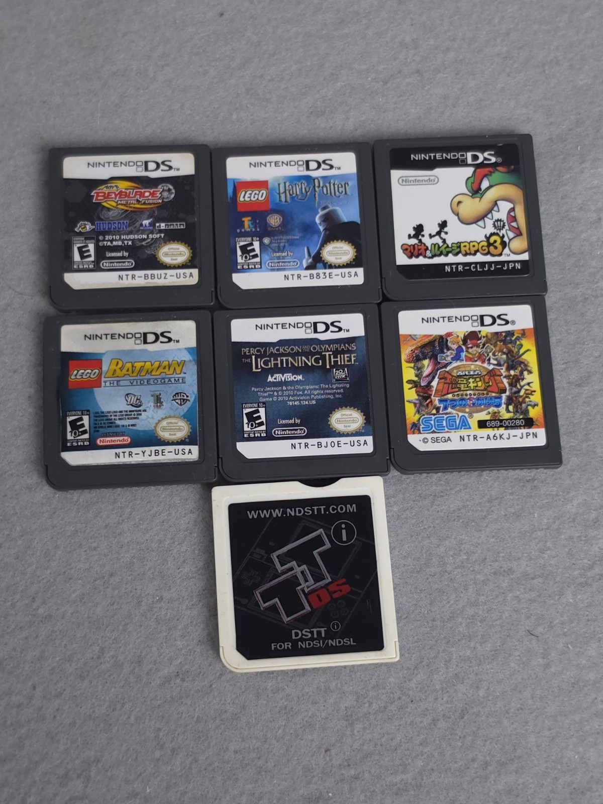 Nintendo DS Lite Console USG-001 with charger – Coral Pink W/6 Games Good Cond.