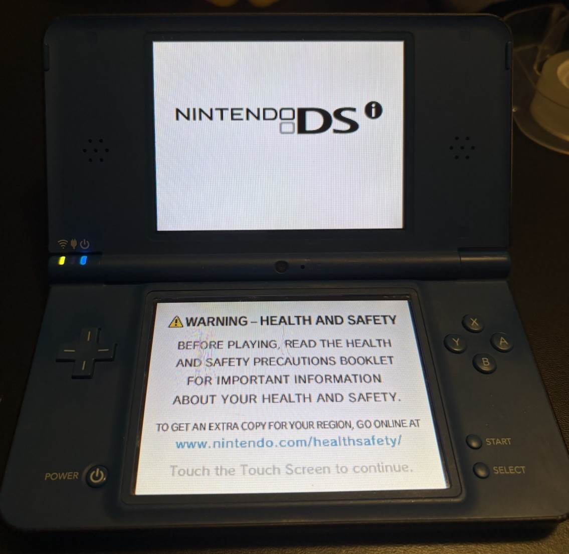 Nintendo DSi XL Midnight w/ USB charger, includes 2 Games, no stylus