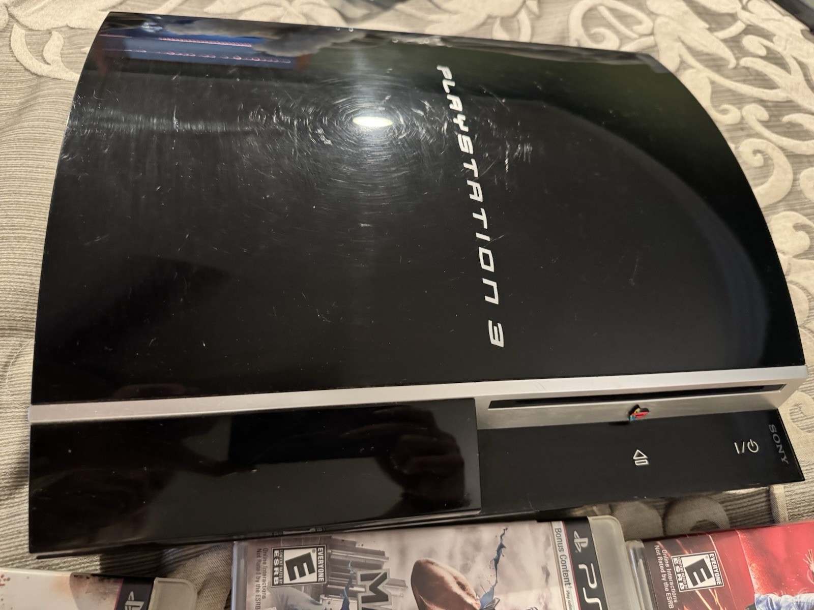 PlayStation 3 Console, Remotes, and 12 game Bundle