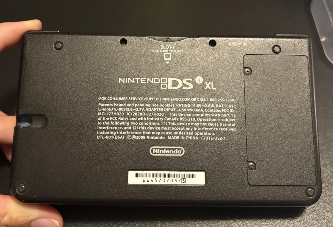 Nintendo DSi XL Midnight w/ USB charger, includes 2 Games, no stylus