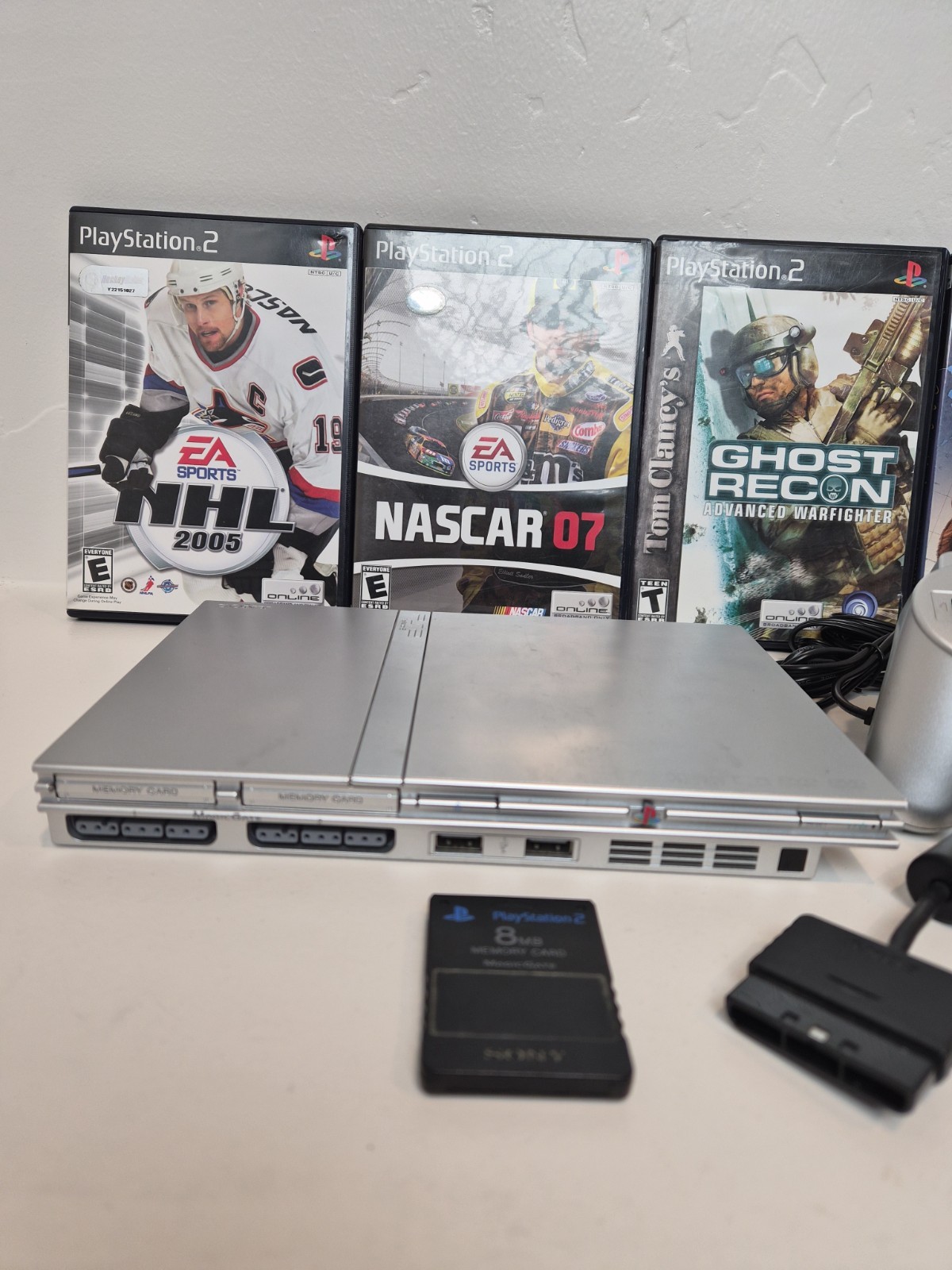NEW LASER Silver PS2 Slim SCPH-77001 Bundle -NEW BATTERY – Cleaned 4 games Cords
