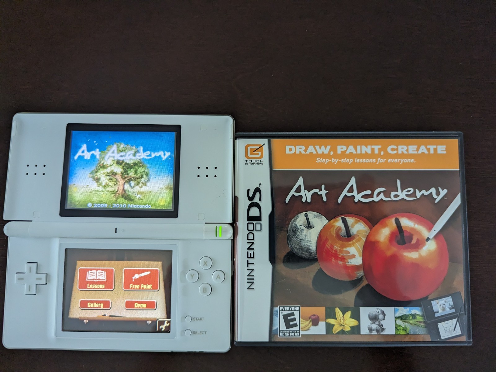 Nintendo DS Lite with Charger, Hard Case, soft case, 15 games in cases.