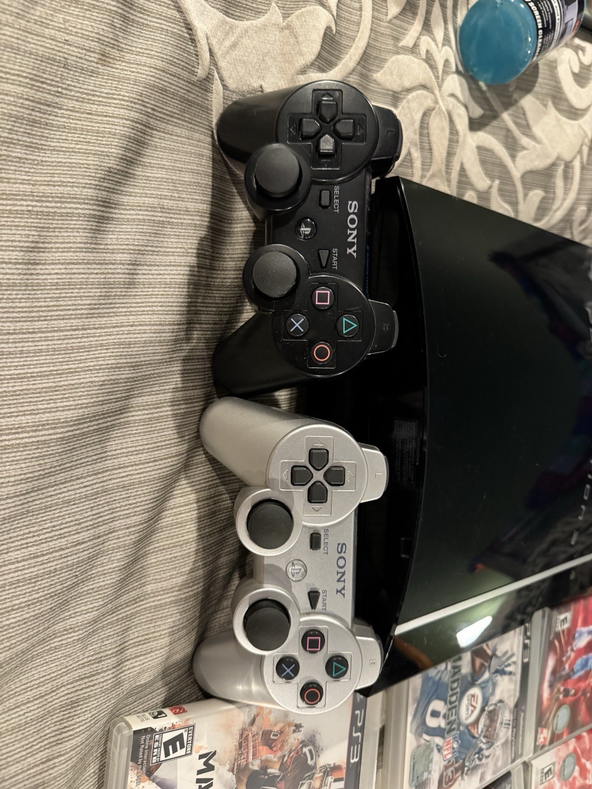 PlayStation 3 Console, Remotes, and 12 game Bundle