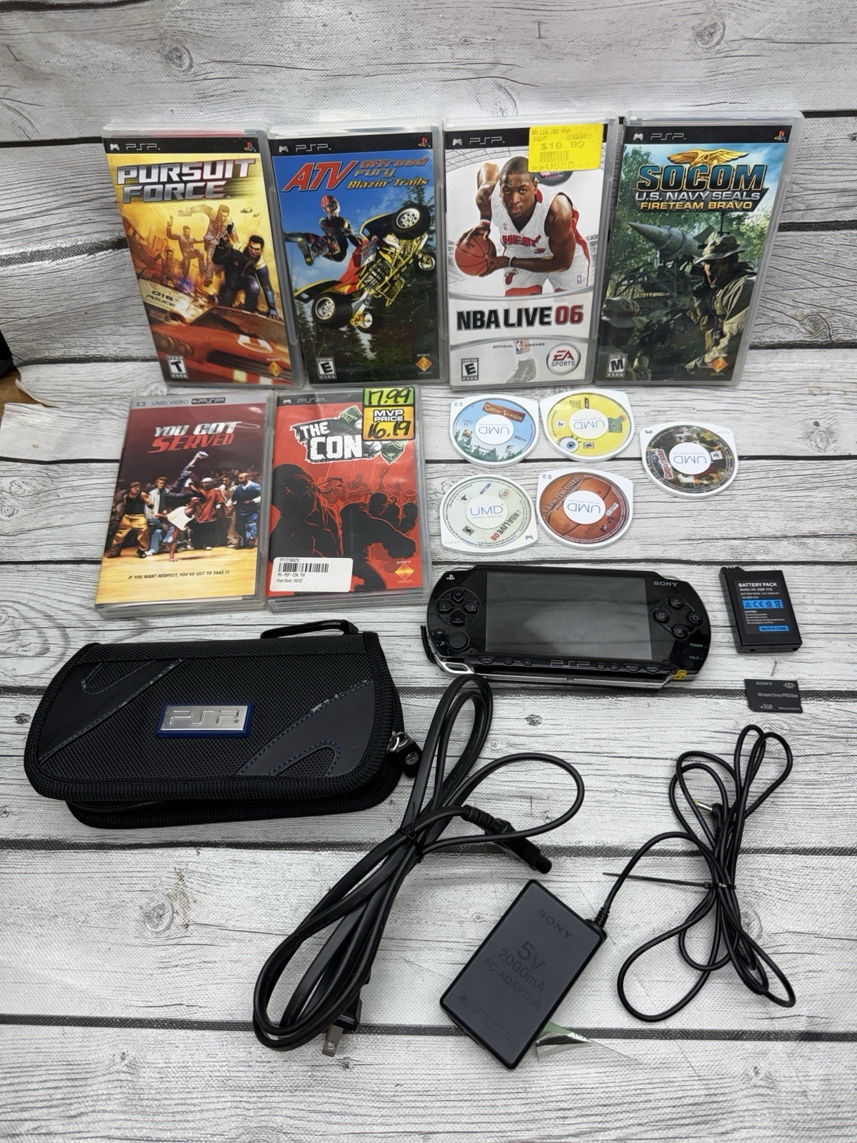 Sony PSP-1001 Black Console With Charger, 1GB Sony Storage Memory Card, 5 Games
