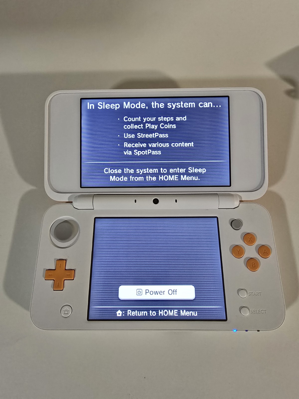 Nintendo 2DS XL Console – White/Orange + Game Cartridge