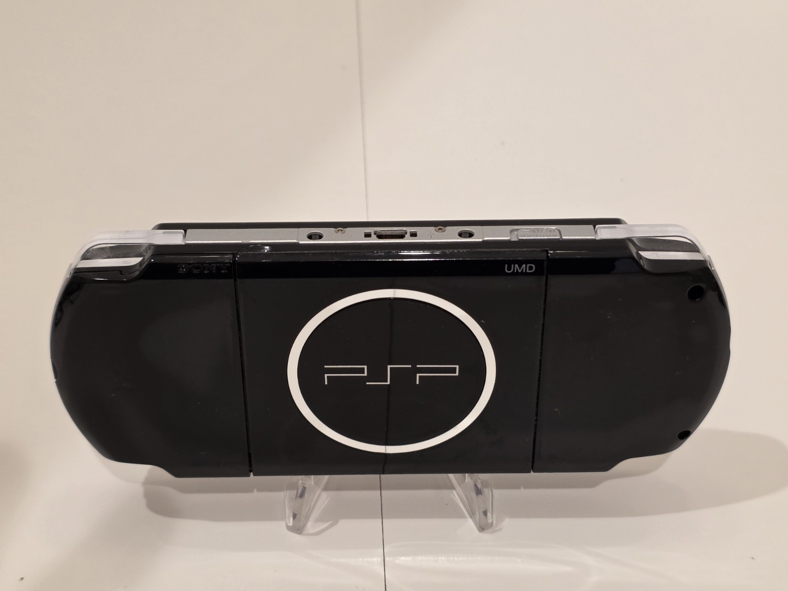 Sony PSP 3001 Black Handheld Console with Charger, Car Adapter, and 5 Games.