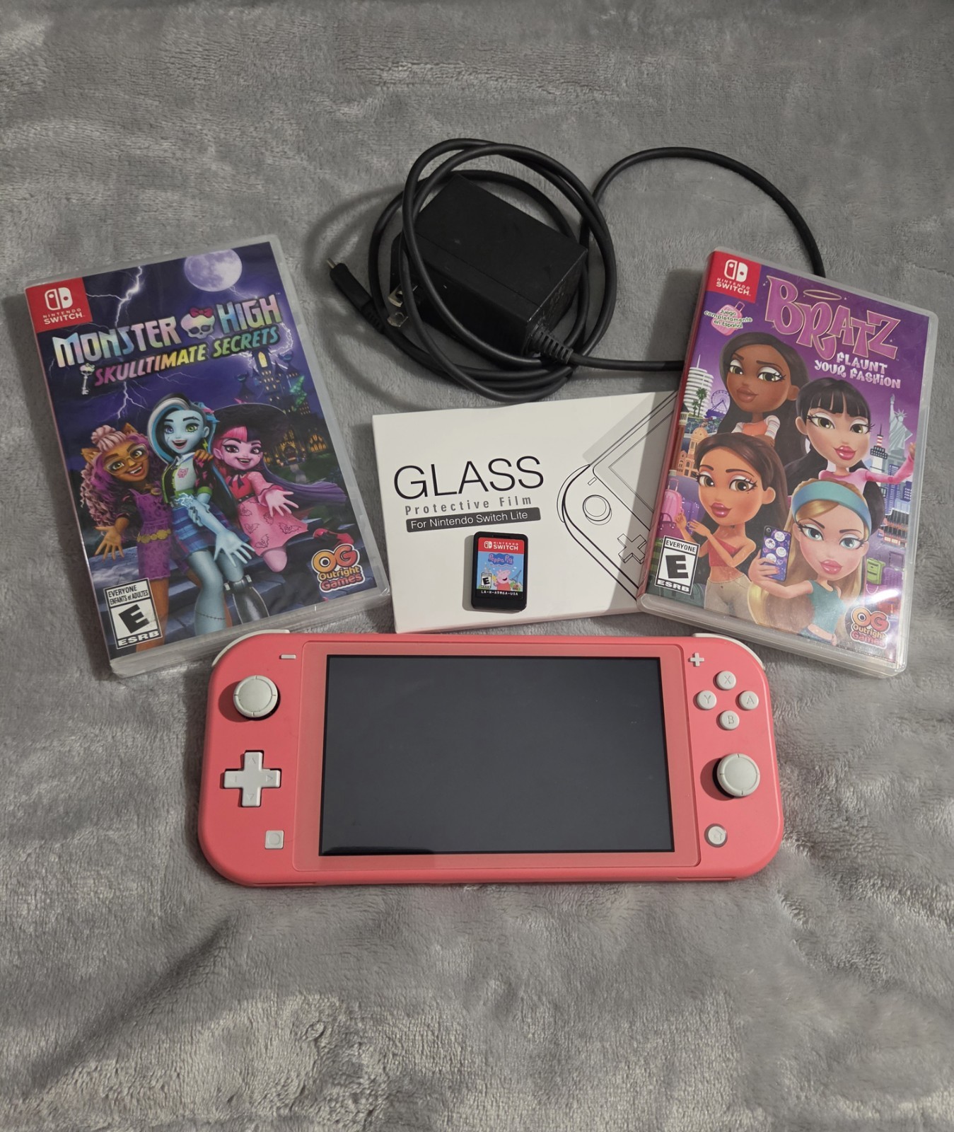 Nintendo Switch Lite Coral with Bratz, Monster High, & Peppa Pig Games, Charger